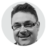 Anthony Andreoli black and white headshot inside circle