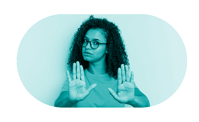 Man sitting with head in hands next to piggy bank with teal overlay