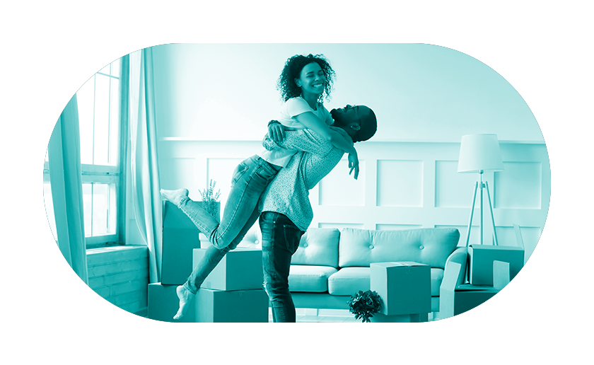 Man hugging woman in the air in new home with teal overlay