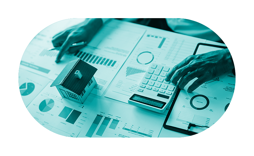 Hands using calculator to look at household finances.